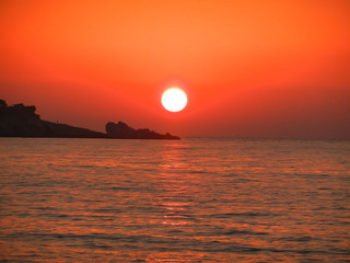fire sky at sunset in Gialiskari, Ikaria island, North Aegean, Greece