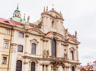Fototapeta na wymiar Fragment of Church of Saint Nicholas. Baroque church in Mala Strana district of Prague. Czech Republic