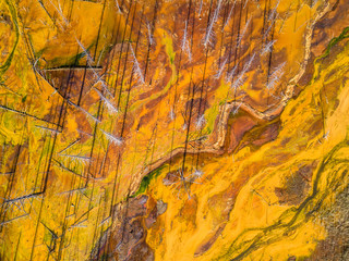 Aerial shot of pollution by toxic waste flowed to the surface and destroys forests and lakes