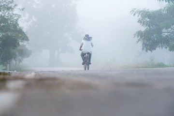 lonely cyclist in the fog