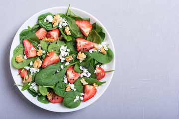 Strawberry salad with spinach , cheese and walnut