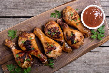 Grilled chicken legs with tomato sauce