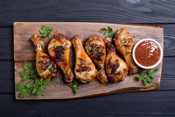 Grilled chicken legs with tomato sauce