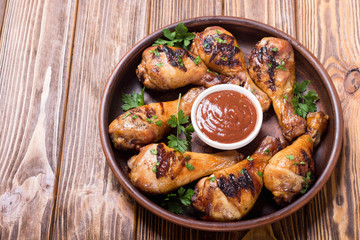 Grilled chicken legs with tomato sauce