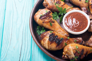 Grilled chicken legs with tomato sauce