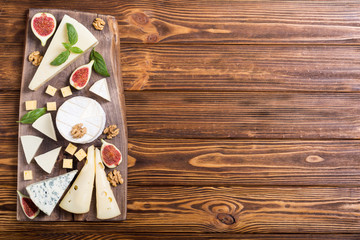 Cheeseboard with cheese brie , parmesan , camembert and dorblu