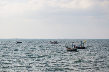 Fishing boats are moored in the bay after fishing.