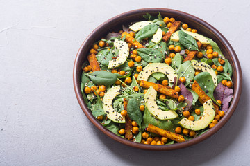 Baby spinach salad with sweet potato , chickpeas and avocado