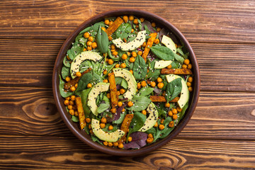 Baby spinach salad with sweet potato , chickpeas and avocado