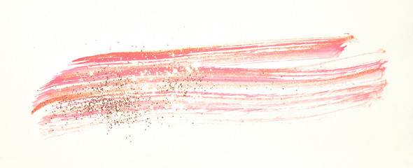 Abstract pink watercolor splash and golden glitter in vintage nostalgic colors.