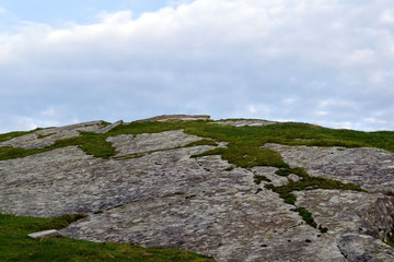 The height of the hill and the sky in the clouds. Close-up.