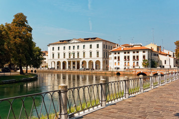 Treviso, Italy August 7, 2018: the river flows among the old buildings of the city.