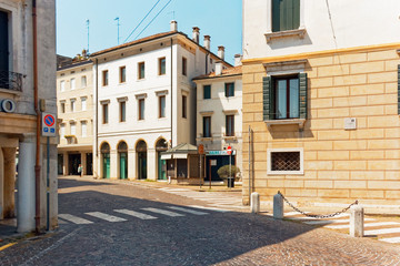 Naklejka premium Treviso, Italy August 7, 2018: Beautiful street with old buildings.