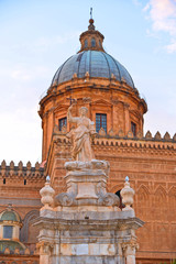 Fototapeta premium The dome of Palermo Cathedral gothic church against warm sunset cloudy blue sky, Sicily, Italy