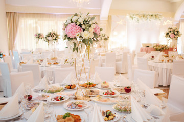 Wedding bouquet in restaurant on the table. Pink and white flowers. Rose and hydrangea
