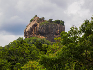 Sigiriya Lion Rock Fortress  near Dambulla, Sri Lanka surrounded by trees during the rainy day