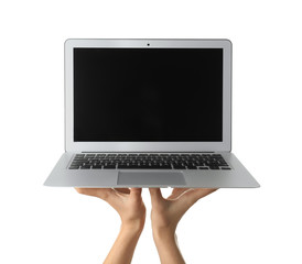 Young woman holding laptop on white background