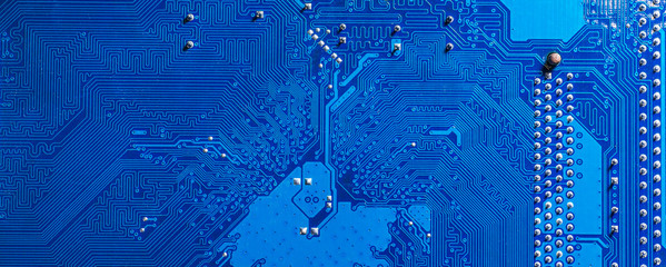 blue circuit board background of computer motherboard