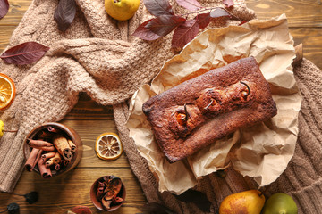 Composition with sweet pear pie on wooden table