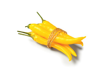 Yellow chili peppers on white background