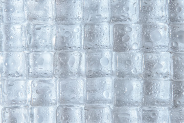 Transparent ice cubes on white background