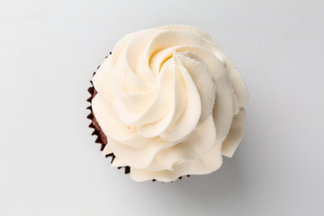 Tasty cupcake on white background