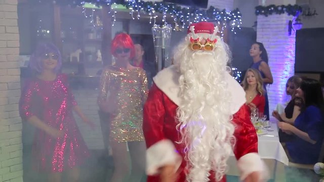 Masquerade new year show party with Santa Claus and animators
