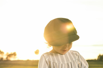 Portrait of a little girl in the countryside at sunset