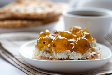 Toast with cottage cheese and jam, breakfast, light background