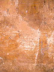 Orange cracked weathered plaster concrete wall background