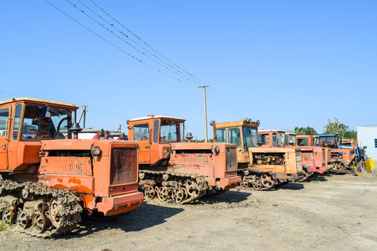 Russia, Temryuk - 15 July 2015: Tractor. Agricultural machinery tractor. Parking of tractor agricultural machinery. The picture was taken at a parking lot of tractors in a rural garage on the