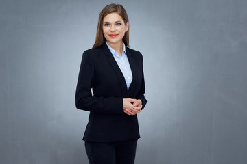 business woman wearing black suit isolated studio portrait.