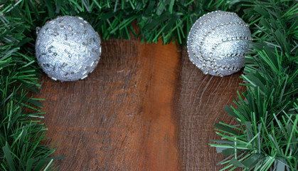 Christmas frame decoration. Silver metallic christmas ornaments  Wooden Background.  Copy Space
