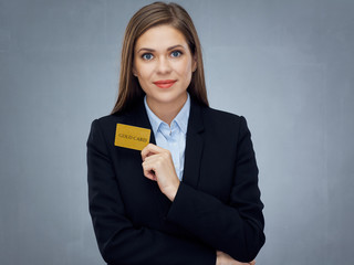 Smiling woman bank employee holding gold credit card