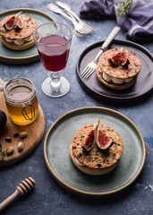 Tarte on sand base with fresh figs, almonds and crispy waffle with almonds and cocoa powder. Fresh Homemade Fruit Tart with berries