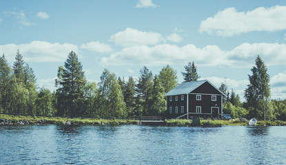 Wooden house by the lake in Swedish lapland