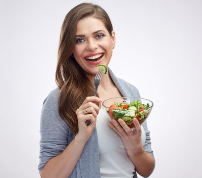 Beautiful woman casual wear dressed eating salad.