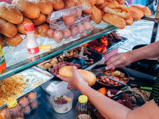 Inside bread store on the street in Vietnam, seller making Vietnamese bread street food, 3 November 2018, Ho Chi Minh City, Vietnam