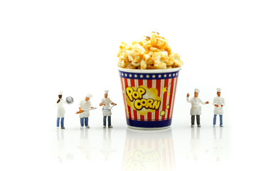 Miniature people : Chef and friend with popcorn.