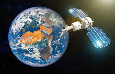 Research satellite with open solar panels in the geostationary orbit of the Earth. Elements of this image furnished by NASA. © aapsky