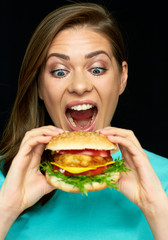 Woman eat burger. Close up face portrait