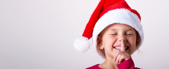 girl child in santa hat portrait on white isolated,