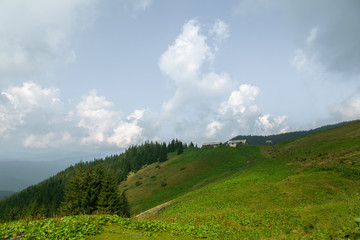 Fototapeta premium Wooden hut in the Carpathian Mountains