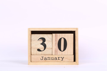 Wooden cubes calendar with the date of January 30. Concept calendar for year with copy space isolated on white background