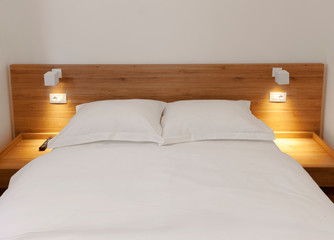 wooden bed in room