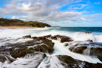 Fototapeta na wymiar Restless waves at Cadillac Canyon, Phillip Island