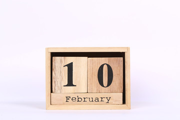 Wooden cubes calendar with the date of February 10. Concept calendar for year with copy space isolated on white background