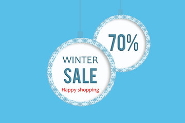 Winter sale 70 % in white blue christmas ball with snowflakes pattern. 