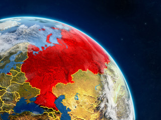 Russia from space on realistic model of planet Earth with country borders and detailed planet surface and clouds.