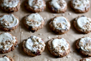 Pile of oatmeal, cranberry and white chocolate cookies. Selective focus.
